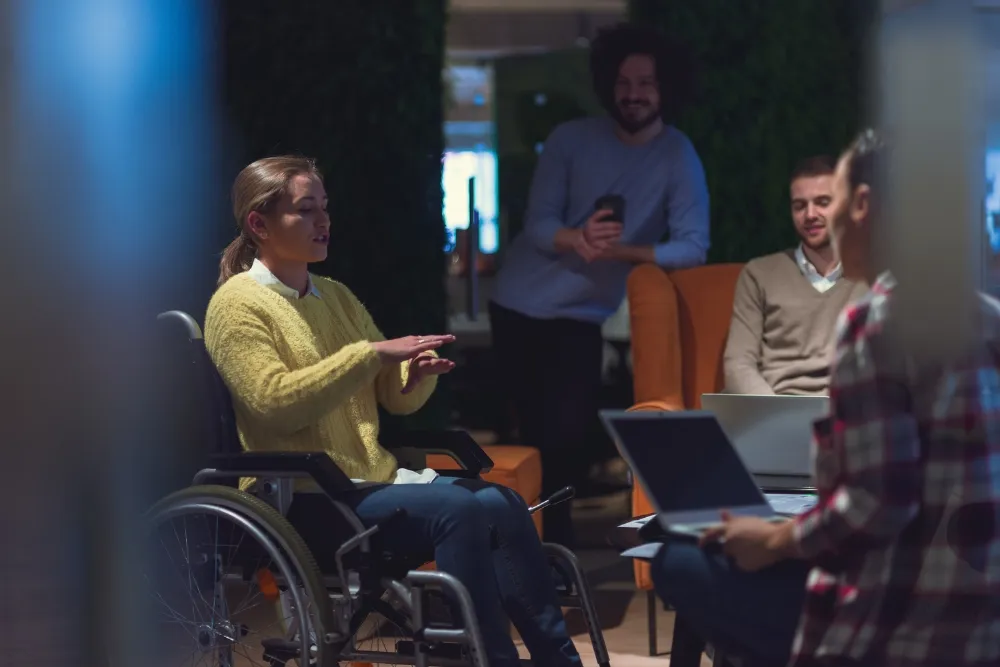 A person with disability discussing with her companion
